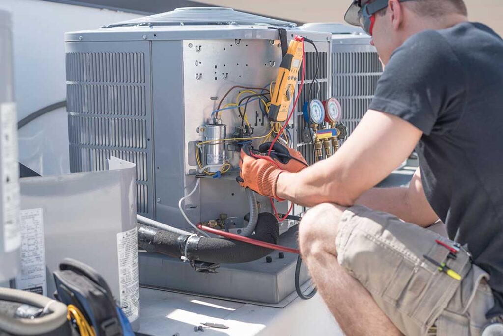 Person replacing a pleated HVAC filter beside a clean return-air vent in a bright home